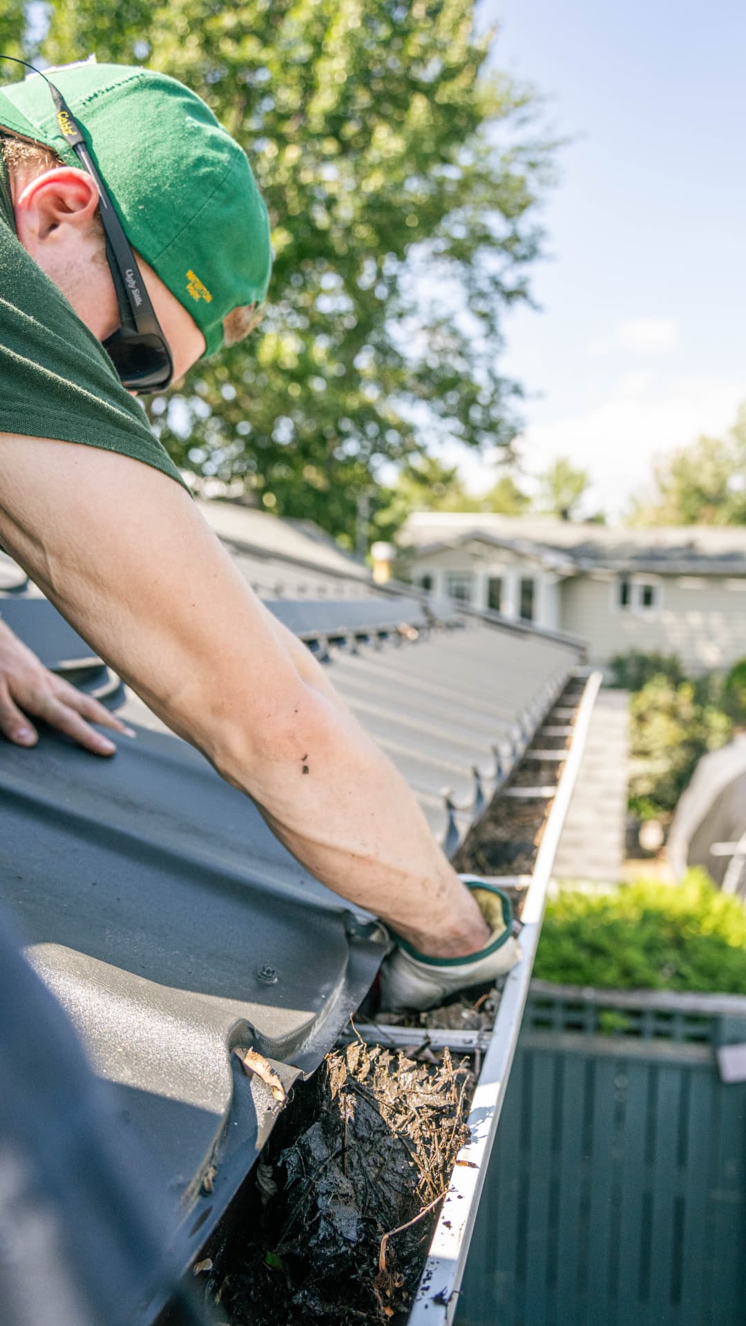 Gutter cleaning — Debris cleared by hand and downspouts flushed