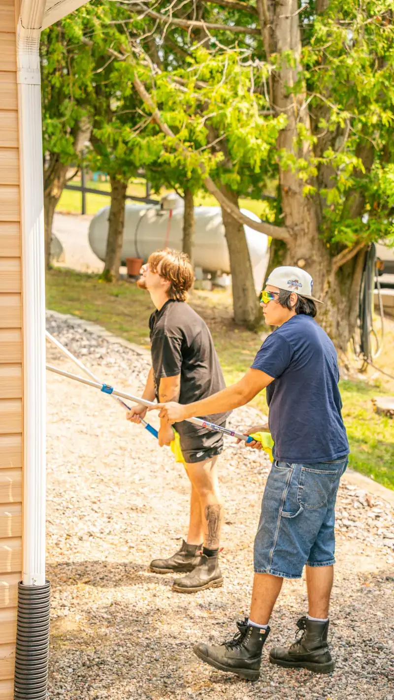 Soft washing house siding with low pressure